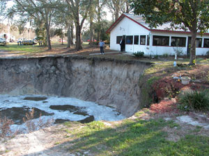 Large Sinkhole Near a Home Opens in new window